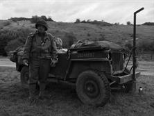 PVT. BOB TRAVIS WITH THE 2 OF THE 3 FRENCH FOOD GROUPS (BREAD, WINE AND CHEESE)