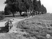 ELEMENTS OF THE 2ND ARMORED MEET UP NEST TO A WWI FRENCH CEMETERY